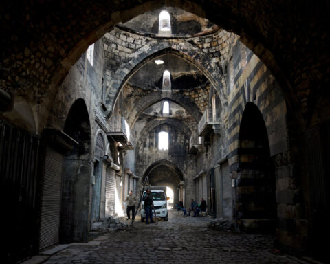 With Syria's Assad gone, his PM agrees to hand power to rebel administration