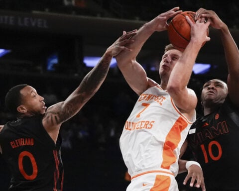 Lanier scores 22 points as No. 1 Tennessee beats Miami 75-62 at Jimmy V Classic