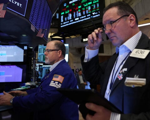 Wall Street closes lower as investors assess data after recent gains