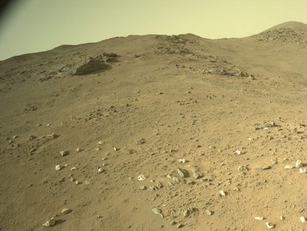 The rover came across a field of bright white rocks, determined to be quartz, during its ascent of the crater rim.