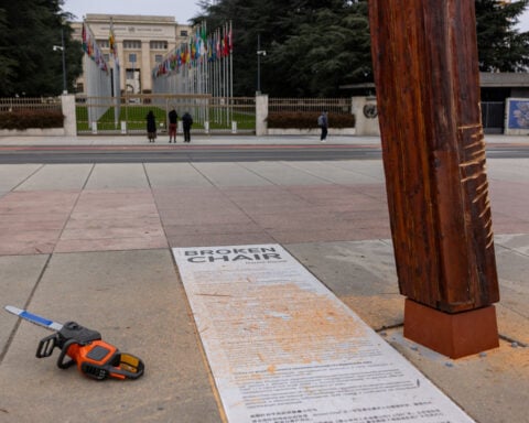 Topless anti-Russia protesters damage monument outside UN in Geneva