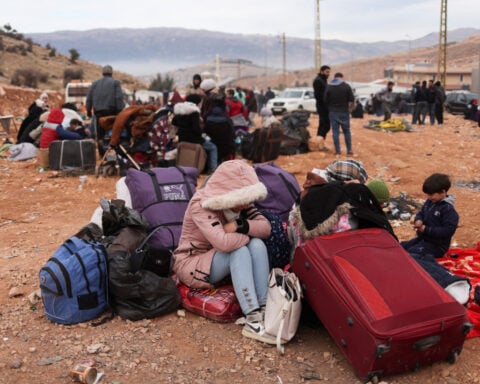 Syrian Shi'ites and other minorities flee to Lebanon, fearing Islamist rule