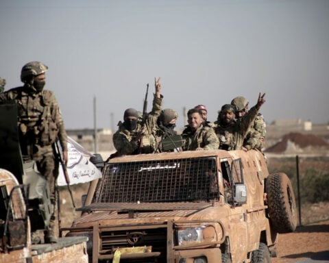 Crucial dam at risk as Kurds and Turkish-backed groups battle in northern Syria