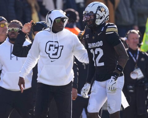 Travis Hunter says Colorado coach Deion Sanders ‘ain’t going nowhere’