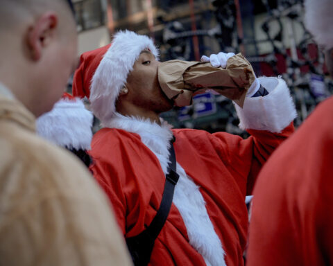 Thousands of Santas and a few Grinches hit the streets for annual SantaCon bar crawls