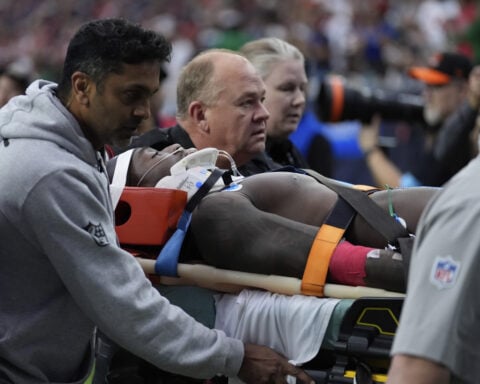 Miami WR DuBose taken off the field on a stretcher after hit to the head against Texans