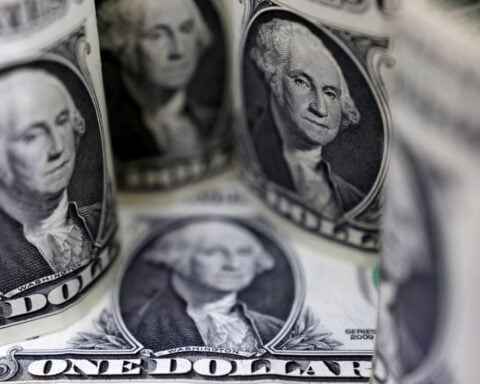 Dollar edges higher against major peers as investors eye Fed rate cut