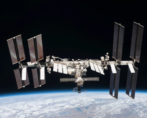 How does the International Space Station orbit Earth without burning up?
