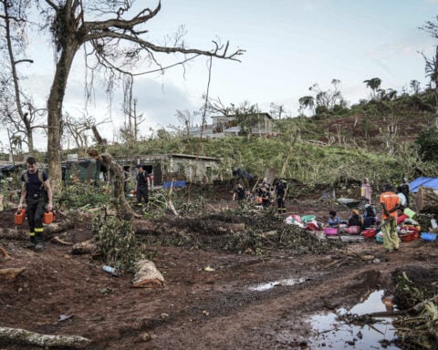 Authorities impose overnight curfew in cyclone-ravaged Mayotte as France rushes in aid