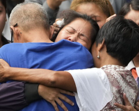 Filipina who won a last-minute reprieve from an Indonesian firing squad returns home