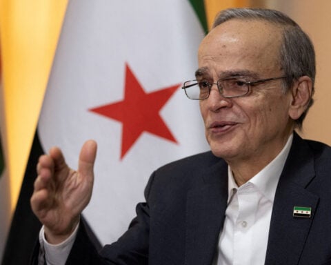 Leader of former Syrian opposition says transitional government should not exclude any party