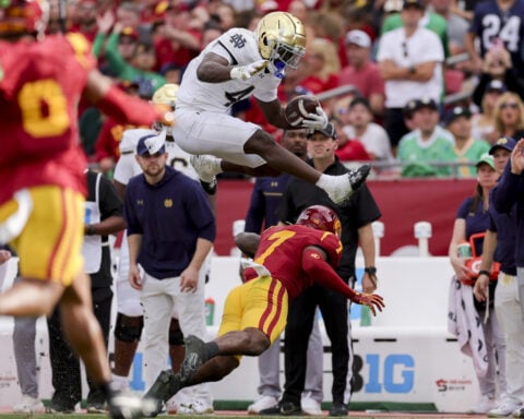 Notre Dame and Indiana get 1st taste of playoff football under the Friday night lights