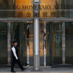 Hong Kong central bank cuts interest rate, tracking Fed move