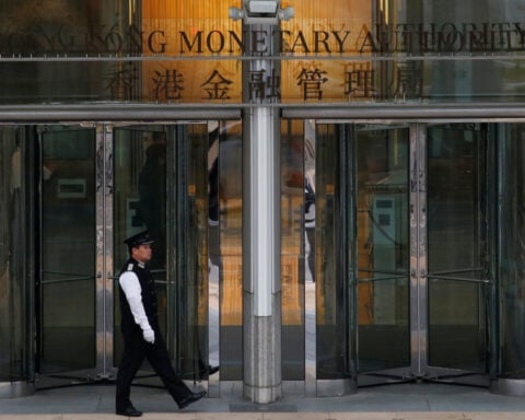 Hong Kong central bank cuts interest rate tracking Fed move, banks follow