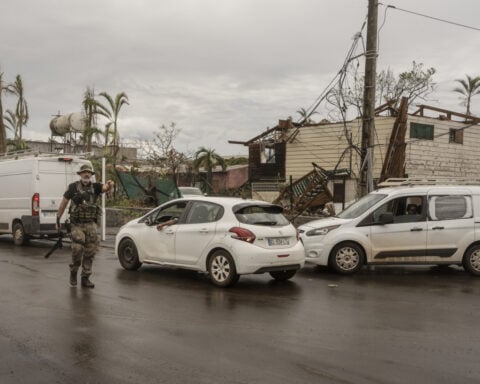 France's Macron visits cyclone-wrecked Mayotte as residents urge for water, food and other aid