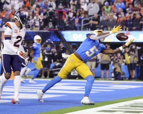 Justin Herbert passes for 2 touchdowns, Chargers score on free kick and rally past Broncos 34-27