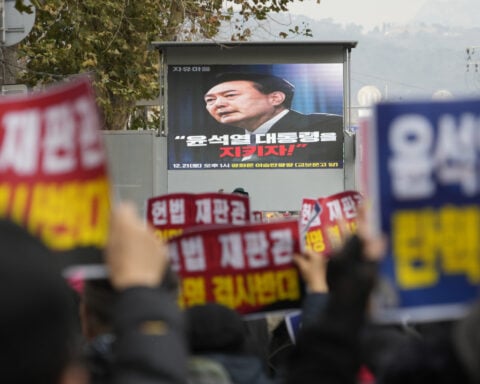 South Korean investigators seek to question reluctant president over martial law