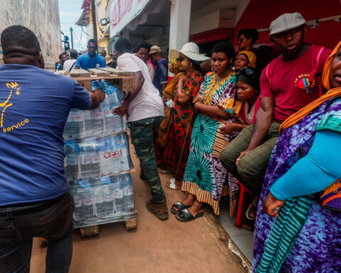 Angry residents of cyclone-hit Mayotte jeer Macron, plead for water