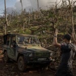 Macron met with anger and frustration over cyclone response during French leader's visit to Mayotte