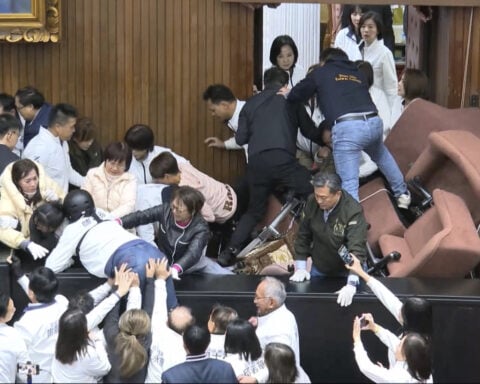 Taiwan lawmakers clash after one party breaks into legislature to occupy speaker's chair