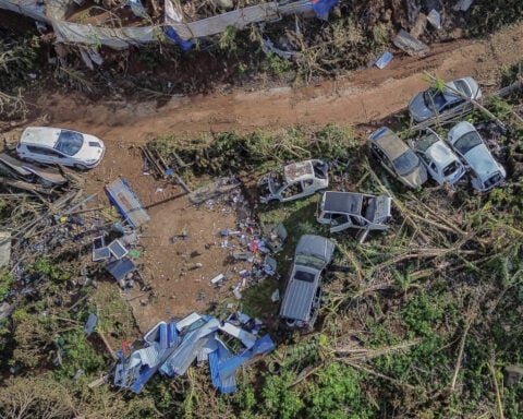 Crowds in Mayotte vent frustration with cyclone response as Macron tours devastation