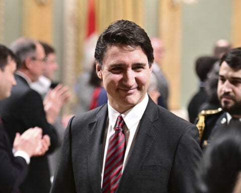 Canada's Trudeau reshuffles his Cabinet as resignation calls mount and new election threat looms