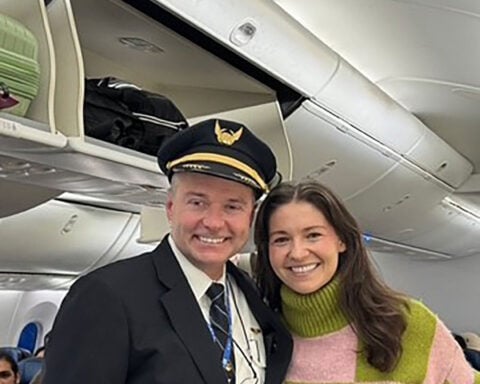 A pilot raced through the airport to surprise an old friend: the woman who saved his life