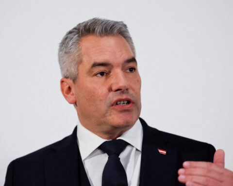 Austria says it is reviewing the status of Syrian refugees