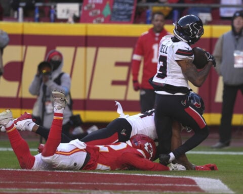 Texans WR Tank Dell hospitalized after severe knee injury on TD catch vs. Chiefs
