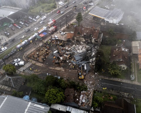 At least 10 are killed as a small plane crashes into a Brazilian town popular with tourists