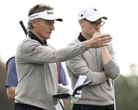 Tiger's son makes the ace. Bernhard Langer makes the winning putt in playoff over Woods at PNC