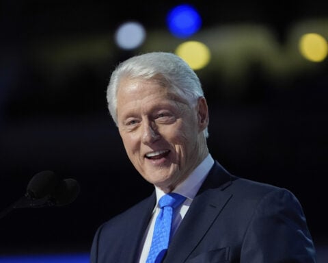 Bill Clinton is hospitalized with a fever but in good spirits, spokesperson says