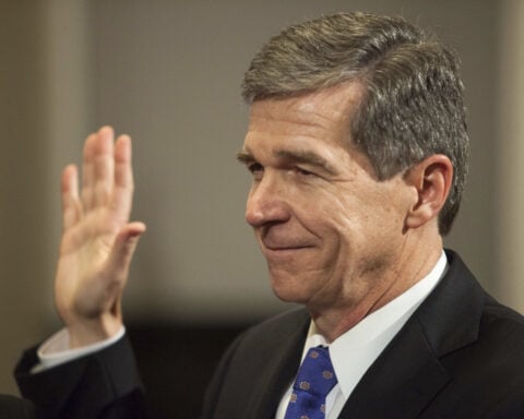 After fighting virus, storms and Republicans, departing North Carolina Gov. Cooper focuses on wins