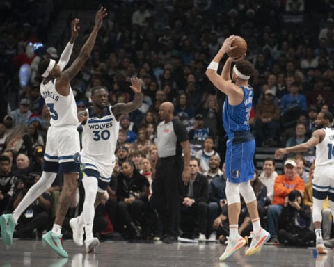 Edwards scores 26, Wolves hold on to beat Mavs 105-99 after Doncic injury