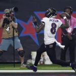 Baltimore's Jackson passes Vick for most yards rushing by a QB in NFL history against Texans