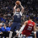 Mavs star Luka Doncic will be out about a month before check on calf injury, AP source says