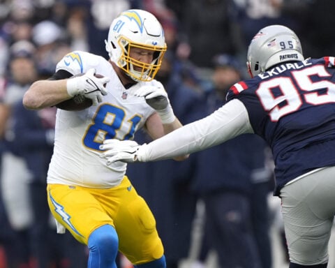 Justin Herbert tosses 3 TDs, Chargers clinch a playoff spot with a 40-7 rout of Patriots