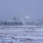 Passengers report flames as Air Canada flight suffers ‘suspected landing gear issue’ after landing