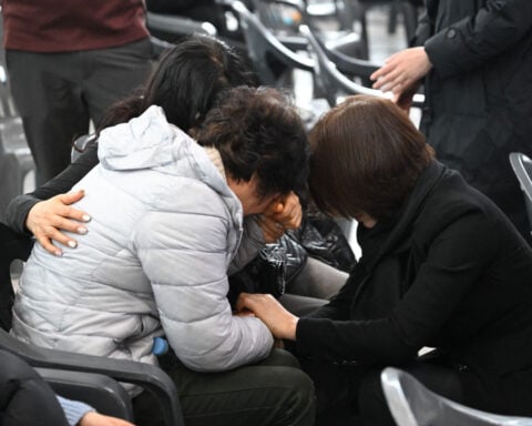 Sobbing and prayers echo through South Korean airport as families mourn air crash victims