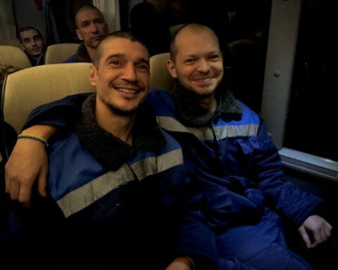 Scores of Ukrainian and Russian POWs head back home after swap