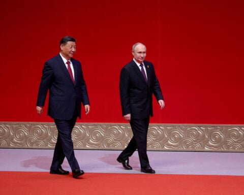 China, Russia always moving forward 'hand in hand', Xi tells Putin