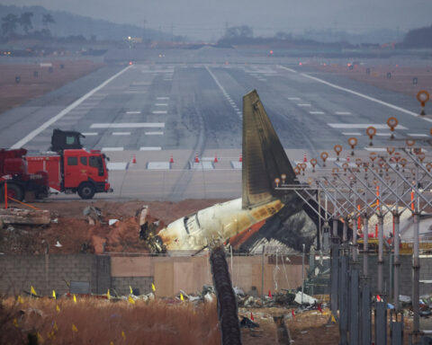 Empty desks and tears mark five colleagues killed in South Korean plane crash