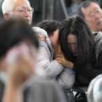 Grieving families of victims of South Korean plane crash visit site for a memorial service