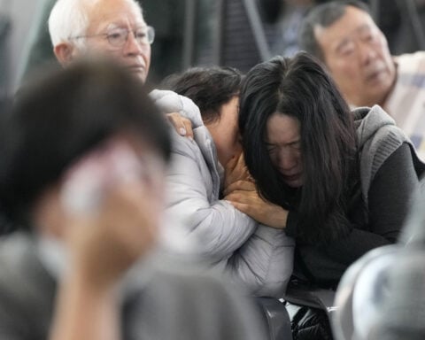 Grieving families of victims of South Korean plane crash visit site for a memorial service