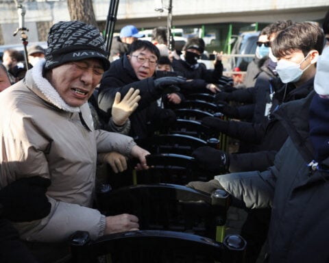 South Korea's Yoon, facing unprecedented arrest over martial law, vows to 'fight until end'