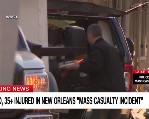 Reporter describes bomb squad working to detonate explosive device