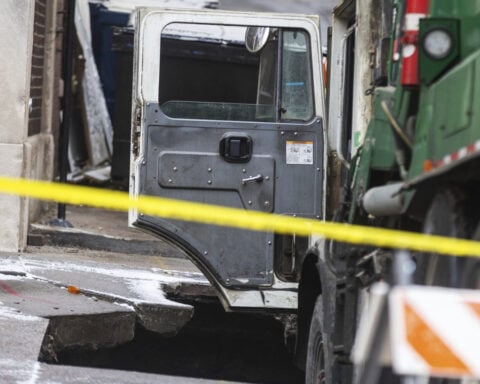 Downtown Omaha loses power for hours after a garbage truck gets stuck in a sinkhole