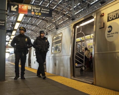 Man pushed onto NYC subway tracks recovering while suspect is charged with attempted murder