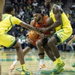 White leads No. 22 Illinois to 109-77 blowout at No. 9 Oregon