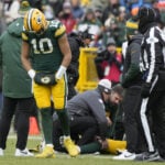 Packers WR Christian Watson carted into locker room. QB Jordan Love also hurt in game against Bears